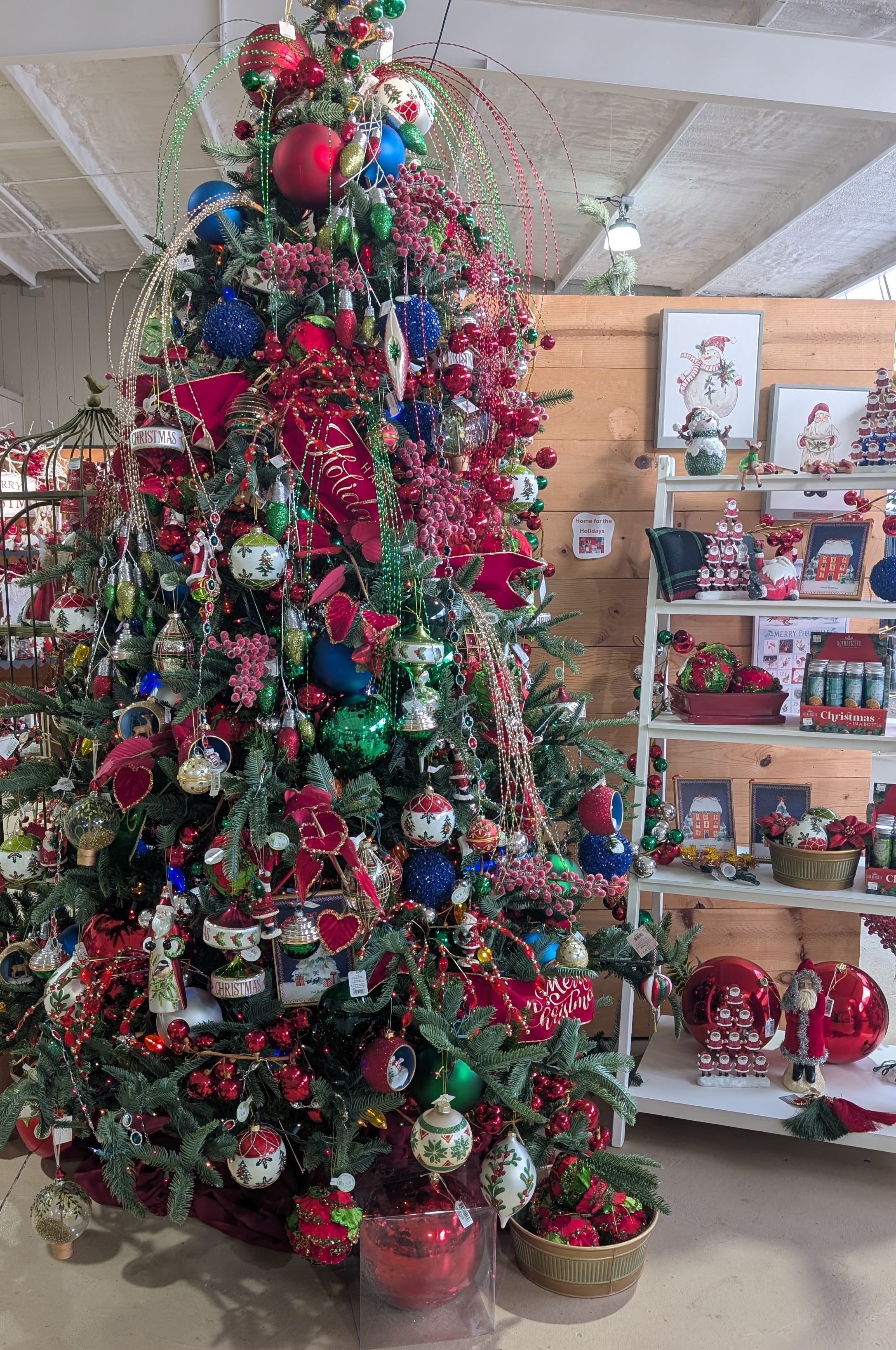 Large tree with multi colored decorations.