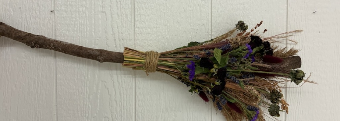 Handmade broom with dried flowers.